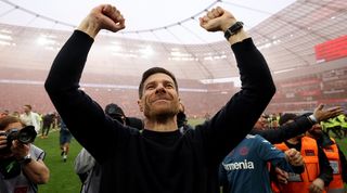 Xabi Alonso celebrates Bayer Leverkusen's Bundesliga title win after victory over Werder Bremen in April 2024.