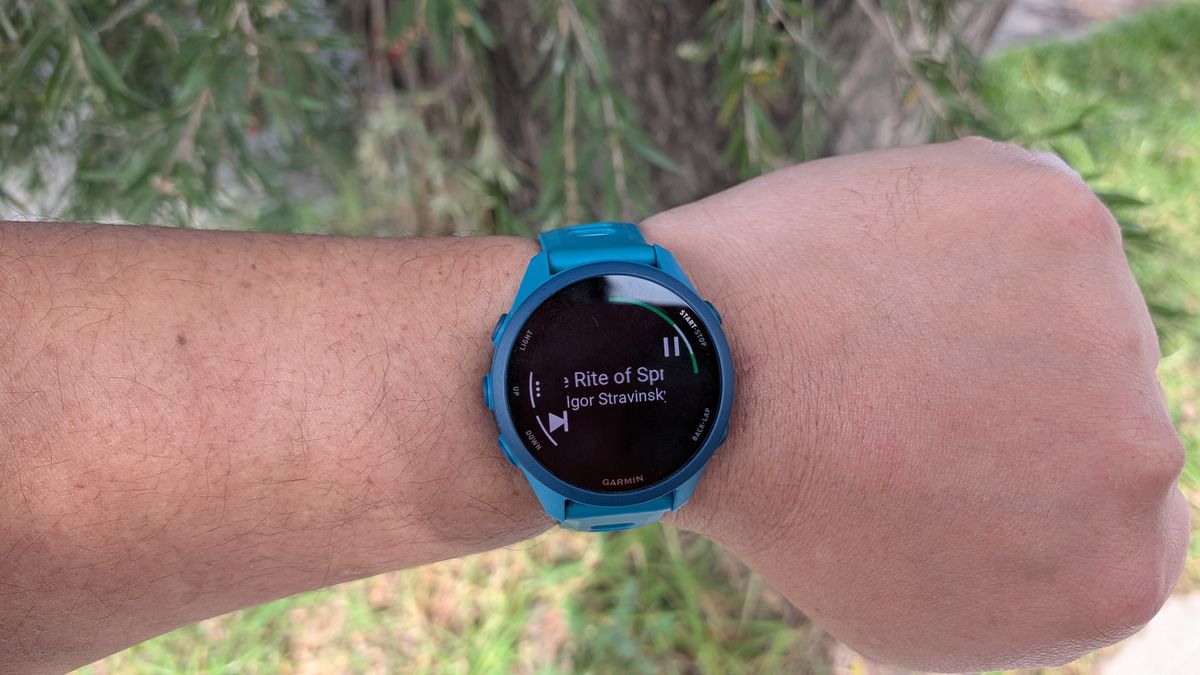 A Garmin Forerunner 170 Music with the music function showcased while worn