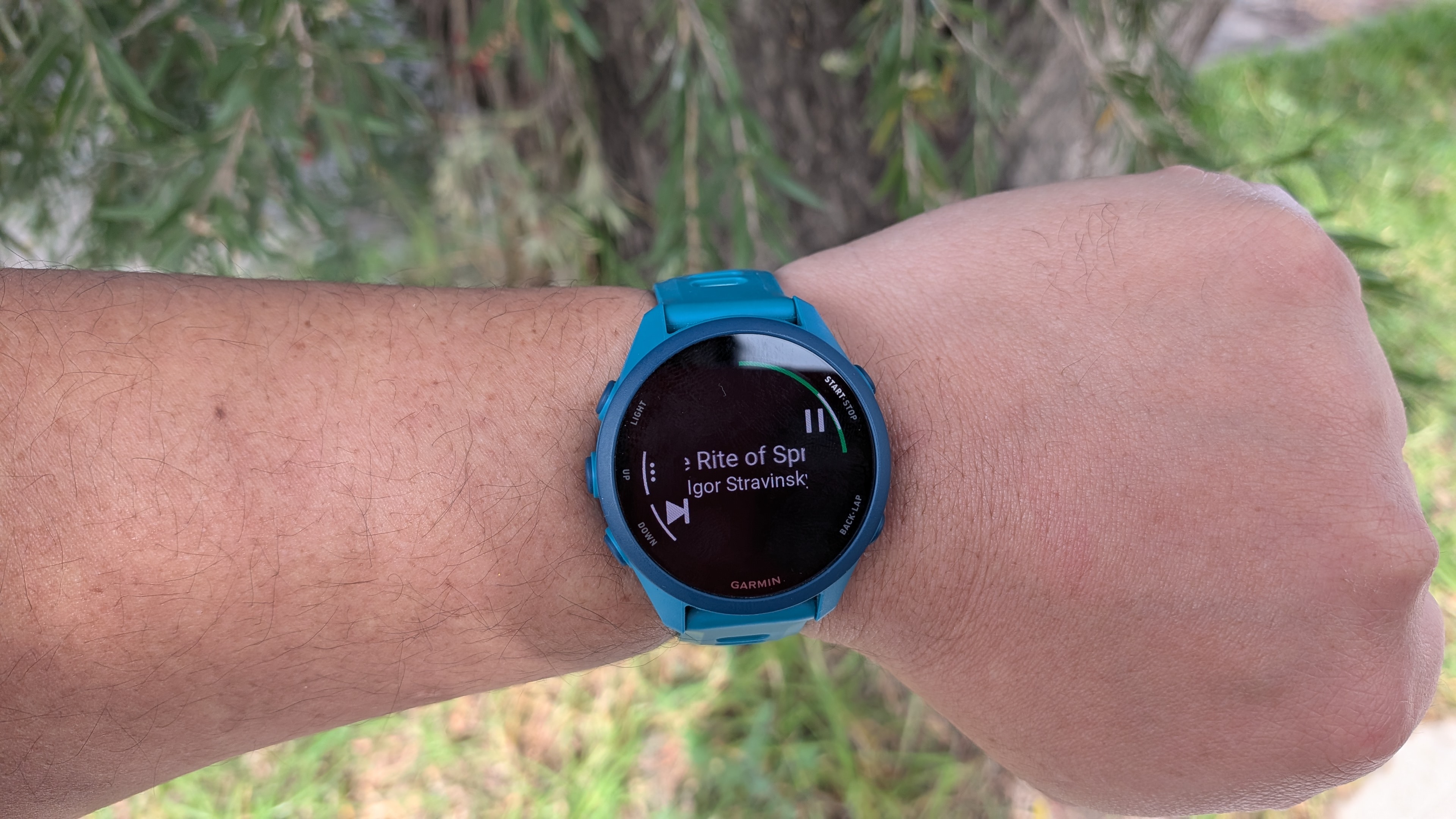 A Garmin Forerunner 170 Music with the music function showcased while worn