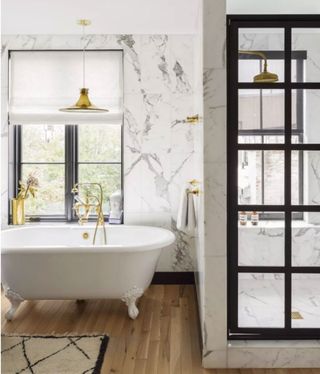 Bathroom in white with marble decor and shower