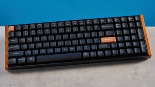 A rosewood Keychron K4 HE magnetic keyboard