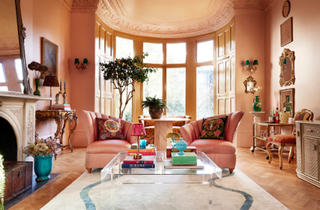 A pink living room with bay window