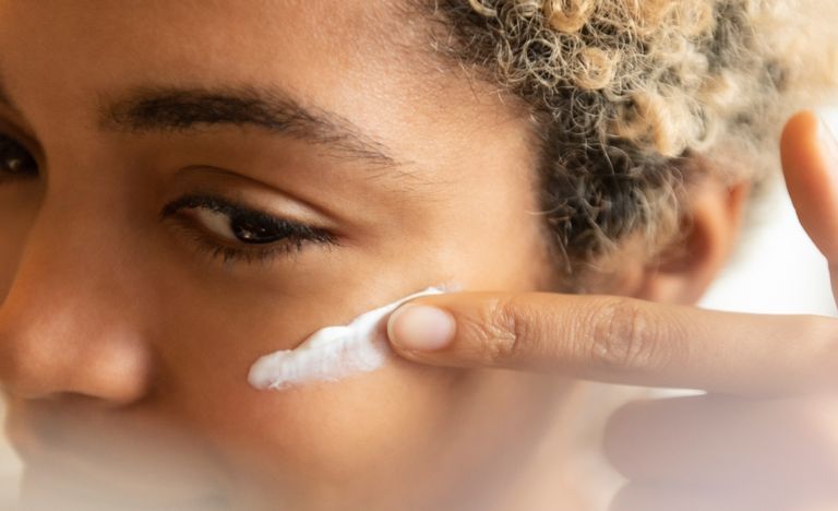 Woman applying moisturizer on her face, moisturizer hacks