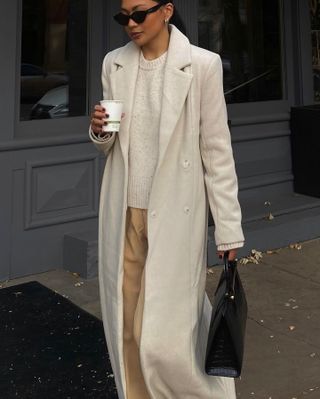 Influencer wears a cream winter outfit