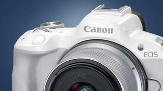 The front of the Canon EOS R50 camera on a blue background