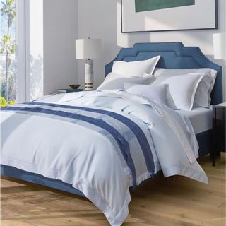 Sferra Marialva Cotton Silk Bedding on a bed.