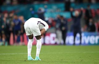 England’s Marcus Rashford reacts after missing in the penalty shoot-out