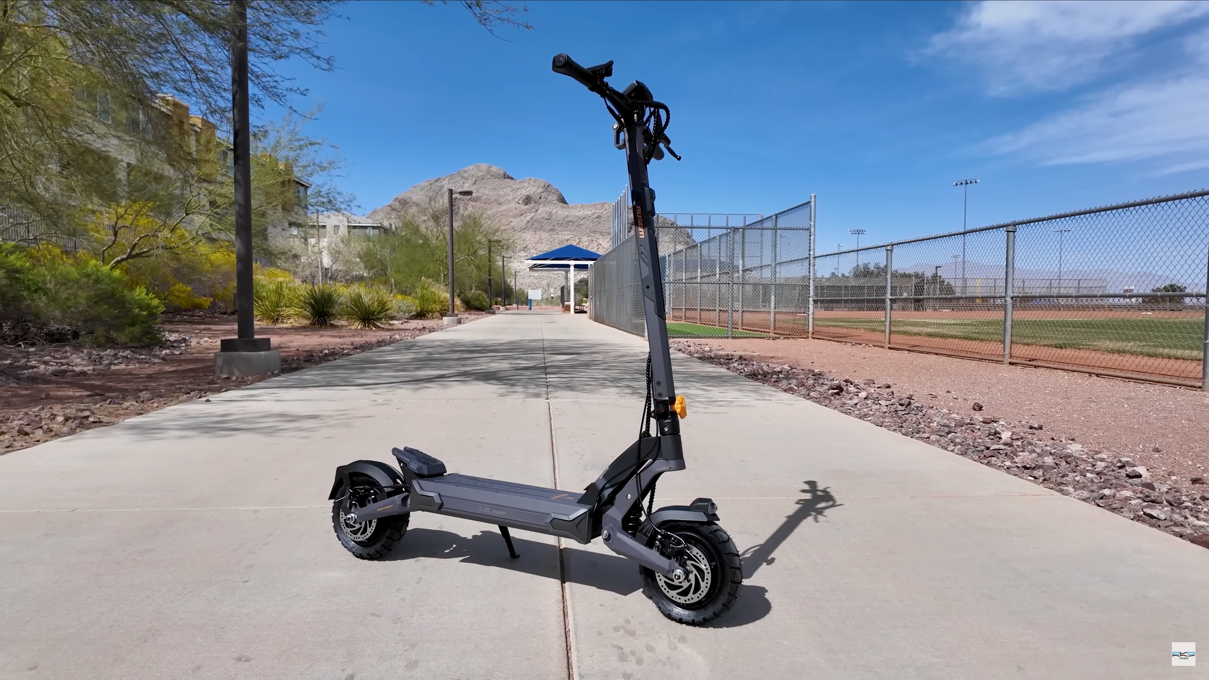 Ausom L2 Max Dual Motor e-scooter parked on a pathway