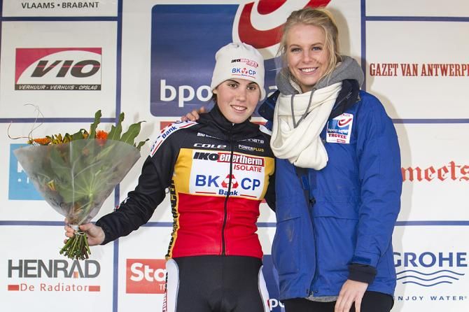 Femke Herygers, daughter of 'cross racer Paul Herygers, towers over Sanne Cant on the podium in Baal