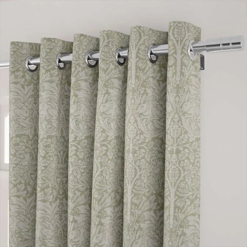 Close up of green and beige william morris floral curtains