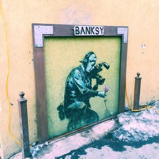 Banksy art on street corner