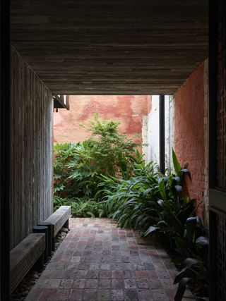 underpass looking out at Stockroom Cottage by Architects EAT