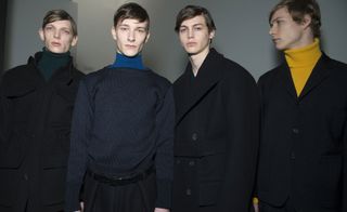 4 men at a fashion show