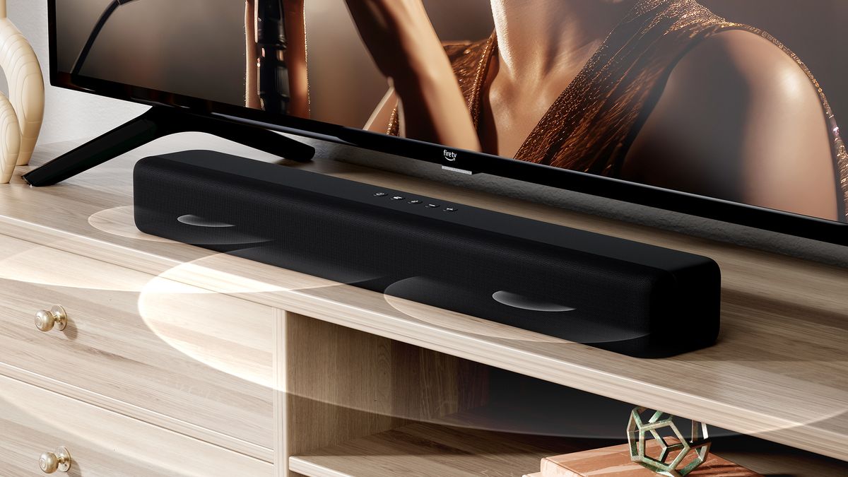 A press image of the Amazon Fire TV Soundbar, of it on a wooden shelf.