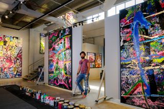 Sacha Jafri interview; a man stands in an art gallery