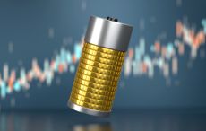 Battery made of coins with financial graph