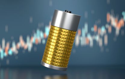 Battery made of coins with financial graph