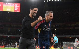 Arsenal manager Mikel Arteta and 1st team coach Albert Stuivenburg celebrate after the Premier League match between Arsenal FC and Aston Villa at Emirates Stadium on August 31, 2022 in London, England.