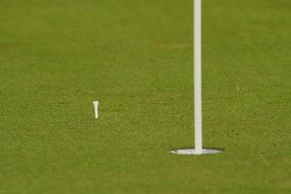 Marking ball on green with a tee