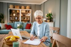 Woman using a laptop to work from home
