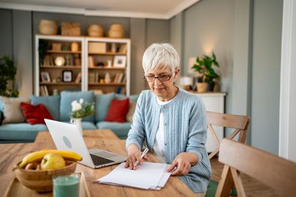 Woman using a laptop to work from home