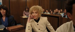 ari graynor as leslie abramson, wearing a white pant suit, in the court room in monsters