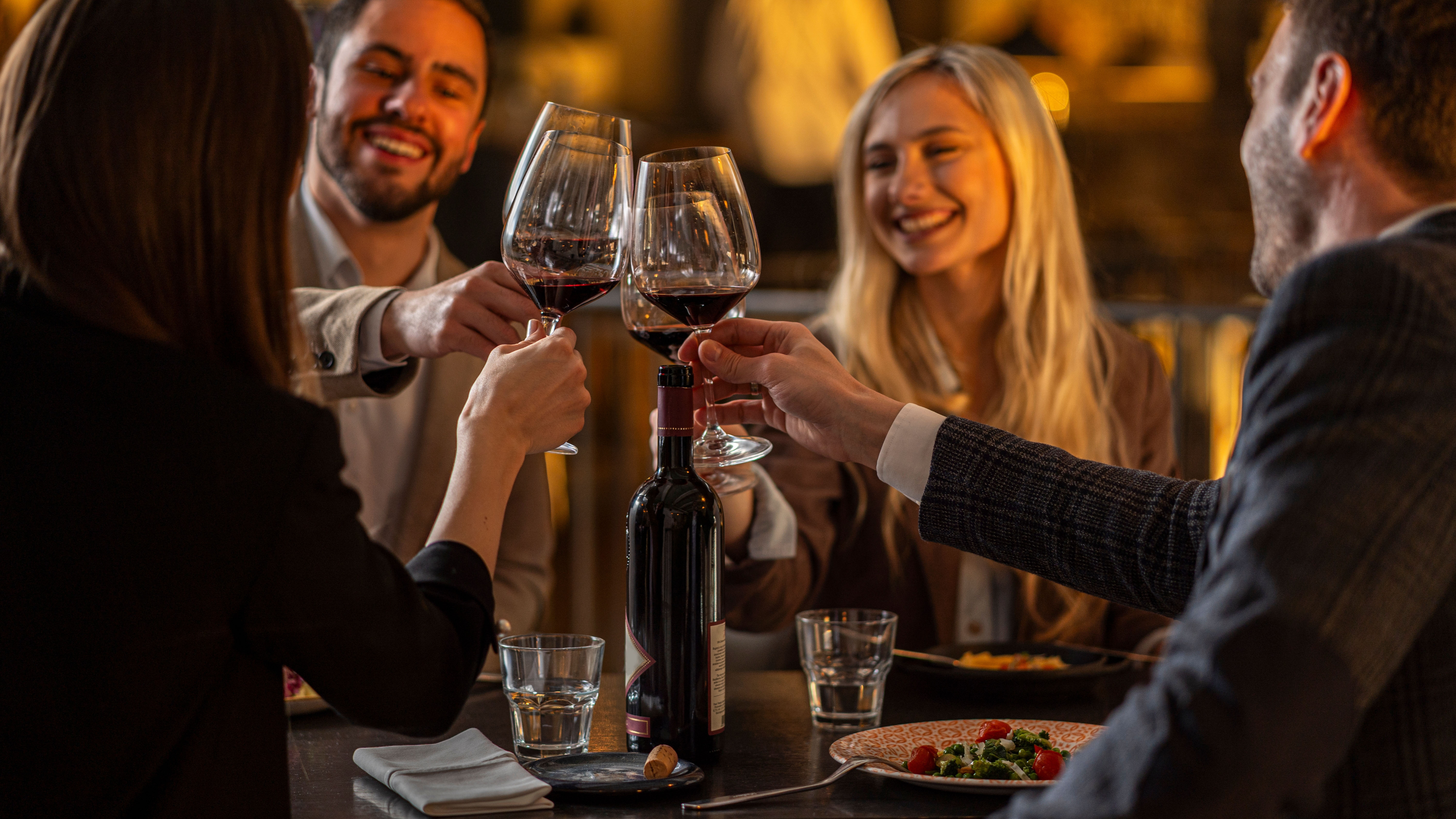 Friends drinking wine in a restaurant.