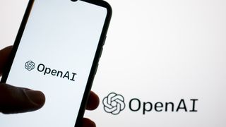 The OpenAI logo is shown on a smartphone screen and on a computer screen in Athens, Greece, on May 21, 2024