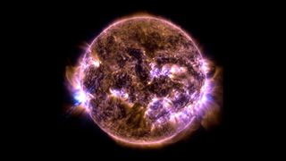 an image of the sun showing a bright white arc of light extending from its left side