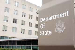 US State Department sign in front of a building
