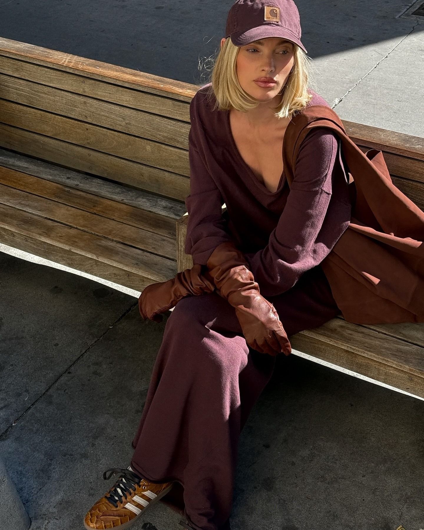 Elsa Hosk wearing a burgundy outfit with straight blonde bob haircut