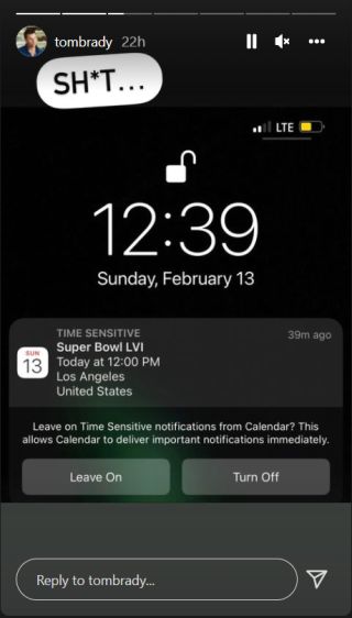 Tom Brady reacts to his phone's reminder about Super Bowl LVI