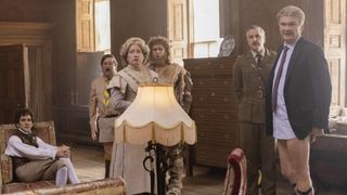 Mathew Baynton seated as Thomas is with Jim Howick as Pat, Martha Howe-Douglas as Lady Button, Laurence Rickard as Robin, Ben Willbond as the Captain and Simon Farnaby as Julian in Ghosts.