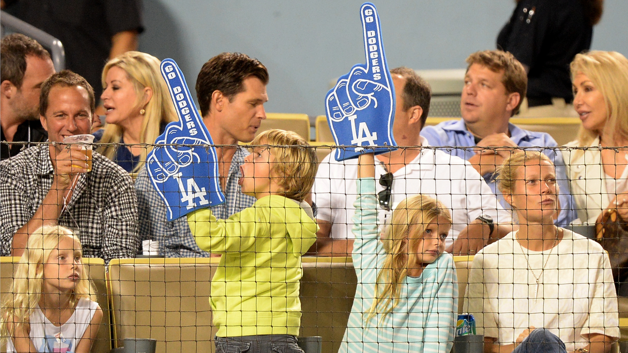 Actress Gwyneth Paltrow (R) and Moses Martin and Apple Martin watch the game between the Arizona Diamondbacks and the Los Angeles Dodgers at Dodger Stadium on September 11, 2013