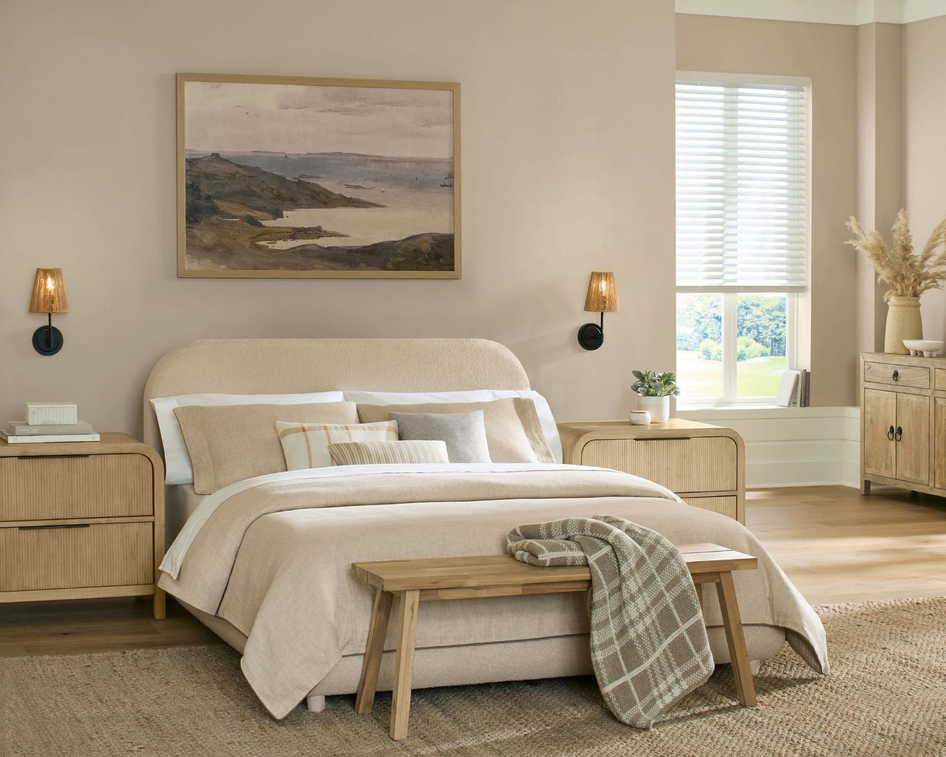 A neutral bedroom scheme with neutral bedding and walls painted in Shiitake by Sherwin Williams