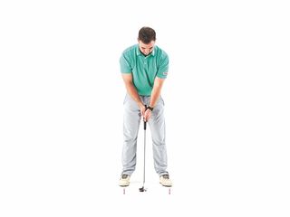 Joshua Mayo demonstrating a putting drill for controlling the length of your stroke