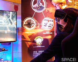 The three Thrustmaster peripherals are shown on the poster behind the virtual-reality setup — a throttle, a joystick and pedals.