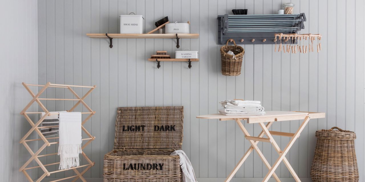 utility room storage in a utility room with ironing board, laundry hamper, drying rack