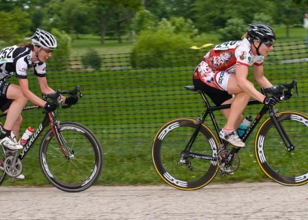 Jennifer Purcell (MSU/HHH), who rode a strong race the day before, accelerates after Van Gilder.