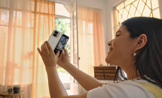 an image of a woman using the cameras on the Google Pixel 9 Fold