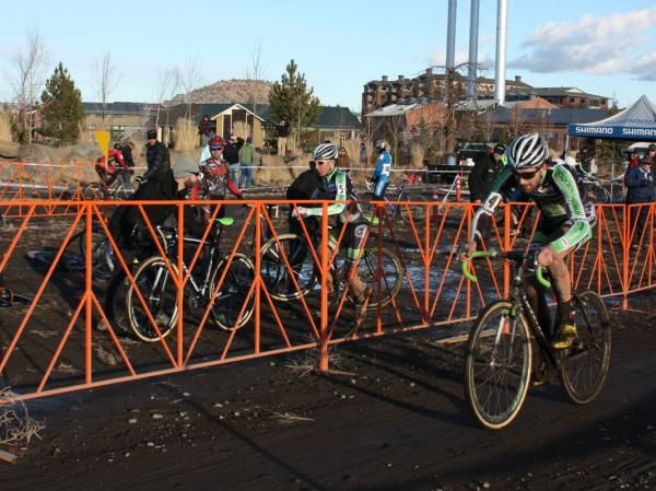 Poetry in motion: Powers has unloaded his bike and is already unclipped and running towards his second bike.