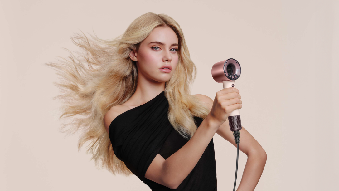 Dyson supersonic travel held by woman