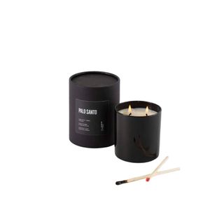 scented candle with two wicks in black glass vessel