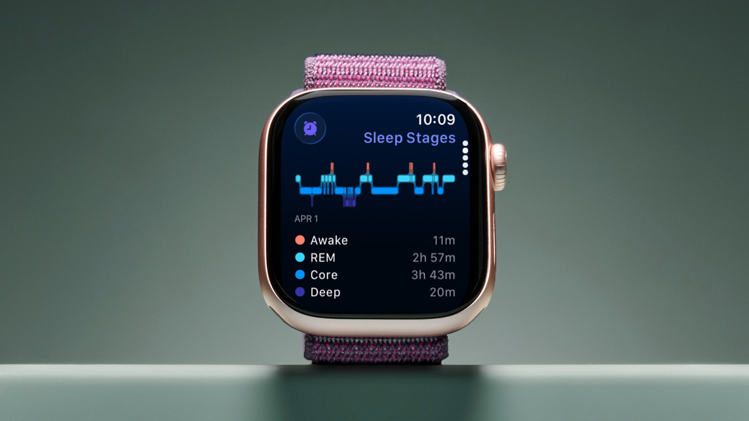 The image shows the Apple Watch Series 10 with a purple strap, set against a sage green backdrop. The screen shows the sleep stages it's tracking. 