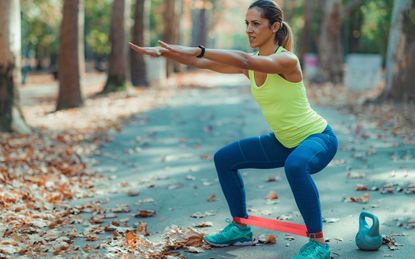 Woman doing a lower body resistance band workout