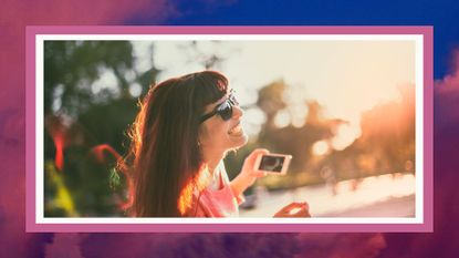 scorpio season memes feature image, woman laughing on phone outside on pink sky background