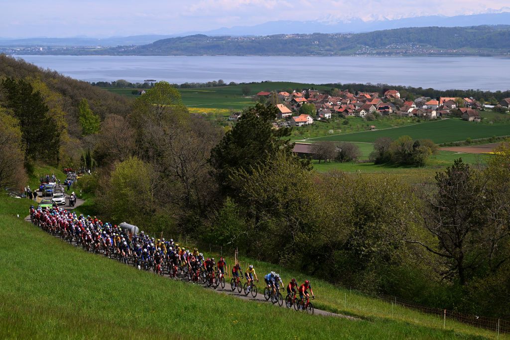 VALLE DE JOUX SWITZERLAND APRIL 26 A general view of Josef Cern of Czech Republic Yellow leader jersey Remi Cavagna of France and Team Soudal QuickStep Blue mountain jersey and the peloton competing for the Neuchatel Lakes landscape during the 76th Tour De Romandie 2023 Stage 1 a 1709km stage from Crissier to Valle de Joux 1019m UCIWT on April 26 2023 in Valle de Joux Switzerland Photo by Dario BelingheriGetty Images