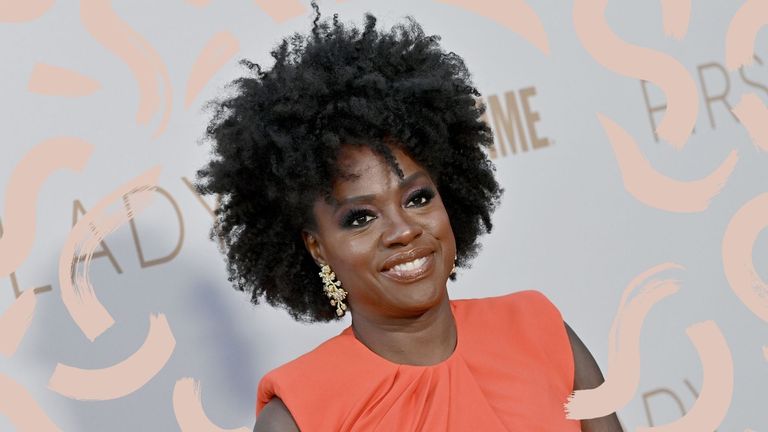 Viola Davis wearing an orange dress with one of the best medium hairstyles for women over 50