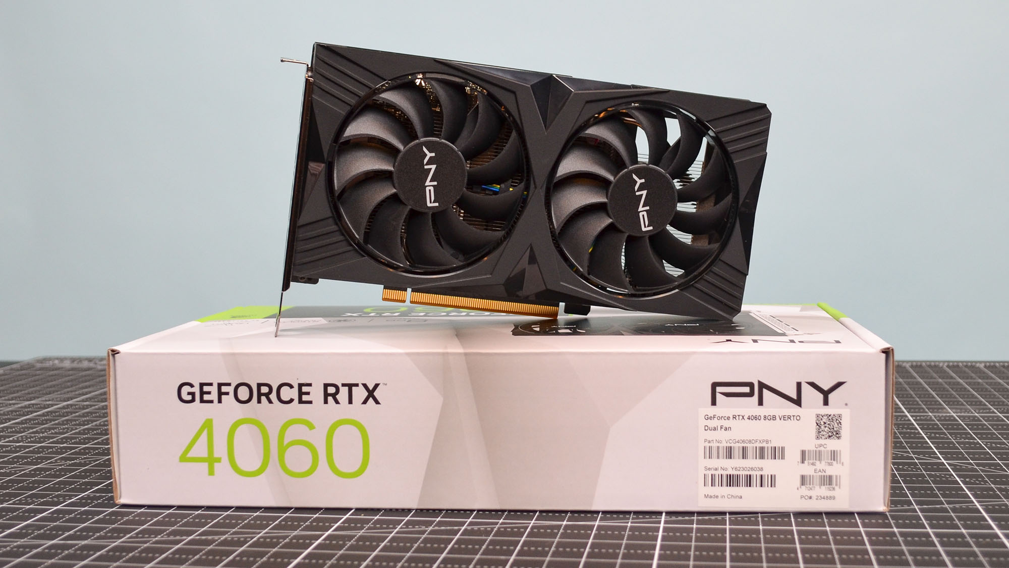 A PNY GeForce RTX 4060 Verto on a table with its retail box