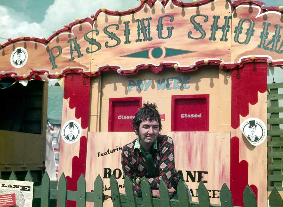 Ronnie Lane poses outside The Passing Show box office